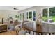 Open-concept living and dining area with hardwood floors and backyard views at 2463 Briarmoor Ne Rd, Atlanta, GA 30345