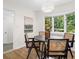 Charming dining area with a round table, bay window, hardwood floors, and stylish decor for comfortable living at 2463 Briarmoor Ne Rd, Atlanta, GA 30345