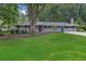 Charming single-story home featuring a well-manicured front yard and a covered front porch at 2463 Briarmoor Ne Rd, Atlanta, GA 30345