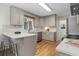 Well-lit kitchen features stainless steel appliances, light countertops, white backsplash, and hardwood floors at 2463 Briarmoor Ne Rd, Atlanta, GA 30345