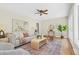 Sunlit living room showcasing hardwood floors, stylish decor, and large windows at 2463 Briarmoor Ne Rd, Atlanta, GA 30345