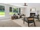 Living room with backyard view, featuring a fireplace, and contemporary decor at 2463 Briarmoor Ne Rd, Atlanta, GA 30345