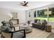 Bright living room with stylish furniture, a brick wall, and a view of the yard at 2463 Briarmoor Ne Rd, Atlanta, GA 30345