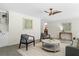Living room with unique wall art, modern seating, and plenty of natural light at 2463 Briarmoor Ne Rd, Atlanta, GA 30345