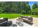 Seating area and lush backyard with a lawn perfect for outdoor entertainment at 2463 Briarmoor Ne Rd, Atlanta, GA 30345