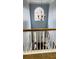 View of foyer from second story, showcasing hardwood floors and a chandelier at 3008 Stockbridge Way, Dacula, GA 30019