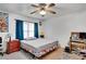 This bedroom features an area rug, a desk, and queen bed featuring colorful bedspread at 4389 Hambrick Way, Stone Mountain, GA 30083