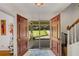 Inviting entryway with large double doors offering views of the front yard and access to the home's interior at 4389 Hambrick Way, Stone Mountain, GA 30083