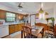 Inviting kitchen with wood cabinets, a dining area, and natural light, perfect for Gathering meals at 4389 Hambrick Way, Stone Mountain, GA 30083