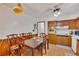 Kitchen with a dining table, wood cabinets, and ample counter space for meal preparation at 4389 Hambrick Way, Stone Mountain, GA 30083