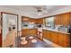 Charming kitchen showcasing wooden cabinets, modern appliances, and a dining area with a wooden table at 4389 Hambrick Way, Stone Mountain, GA 30083