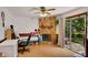 Inviting living room with a unique stone fireplace and sliding glass doors leading to the backyard at 4389 Hambrick Way, Stone Mountain, GA 30083
