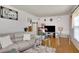 Bright living room featuring hardwood floors, neutral decor, and an abundance of natural light at 4389 Hambrick Way, Stone Mountain, GA 30083