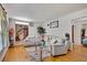 Spacious living room with hardwood flooring, a comfortable couch, and decorative touches throughout at 4389 Hambrick Way, Stone Mountain, GA 30083