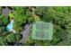 Overhead view of community tennis courts, swimming pool, parking lot, and lots of trees at 1010 Donegal Se, Smyrna, GA 30080