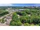 An aerial view of the neighborhood with tree coverage and buildings in the distance at 1010 Donegal Se, Smyrna, GA 30080