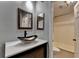 Stylish bathroom featuring a vessel sink, framed mirror, and a shower-tub combo at 1010 Donegal Se, Smyrna, GA 30080