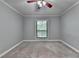Bedroom with neutral gray walls, carpet and a window at 1010 Donegal Se, Smyrna, GA 30080