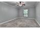 Bedroom with a window offering natural light and ceiling fan at 1010 Donegal Se, Smyrna, GA 30080