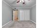 Bedroom with fan, closet and neutral gray walls and carpet at 1010 Donegal Se, Smyrna, GA 30080