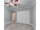 Bedroom with fan, closet and neutral gray walls and carpet at 1010 Donegal Se, Smyrna, GA 30080