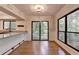 Bright dining area with hardwood floors, large windows and glass patio doors leading to outdoor deck at 1010 Donegal Se, Smyrna, GA 30080