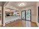 Bright dining area with hardwood floors, large windows and glass patio doors leading to outdoor deck at 1010 Donegal Se, Smyrna, GA 30080