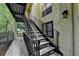 Exterior view of the building with stairs and railings, providing access to units at 1010 Donegal Se, Smyrna, GA 30080