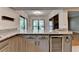 Kitchen featuring granite countertops, a wine fridge, and access to both a breakfast nook and living room at 1010 Donegal Se, Smyrna, GA 30080