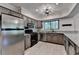 Traditional kitchen featuring granite countertops, wooden cabinets, and stainless steel appliances at 1010 Donegal Se, Smyrna, GA 30080