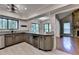 Kitchen featuring granite countertops, a wine fridge, and access to both a breakfast nook and living room at 1010 Donegal Se, Smyrna, GA 30080