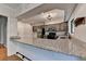 Kitchen with granite counters, stainless appliances, hardwood floors and view of the dining area at 1010 Donegal Se, Smyrna, GA 30080