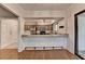 Open view of the kitchen with stainless appliances, granite countertops, and a breakfast bar at 1010 Donegal Se, Smyrna, GA 30080