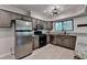 Modern kitchen featuring stainless steel appliances, neutral tone cabinetry and updated lighting at 1010 Donegal Se, Smyrna, GA 30080