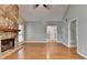 Spacious living room with hardwood floors, fireplace, and doorways to hallway, and other rooms at 1010 Donegal Se, Smyrna, GA 30080