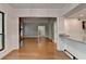 Open floor plan with living room and kitchen, hardwood floors, and neutral decor at 1010 Donegal Se, Smyrna, GA 30080