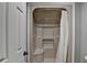 A well-lit shower unit with a seat and a white shower curtain at 1010 Donegal Se, Smyrna, GA 30080