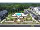 Aerial view of pool and amenity center with landscaping at modern townhome community at 1104 Knoxboro Ln, Woodstock, GA 30188