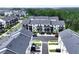 Aerial view of a modern townhome community with lush landscaping and well-maintained streets at 1104 Knoxboro Ln, Woodstock, GA 30188