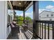 Outdoor balcony with patio furniture and wooden railings, overlooking the neighborhood at 1104 Knoxboro Ln, Woodstock, GA 30188