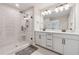Bright bathroom featuring a double vanity, framed mirrors, matte black fixtures, and a glass enclosed shower at 1104 Knoxboro Ln, Woodstock, GA 30188