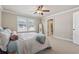Comfortable bedroom showcases neutral colors, natural light, and ample space at 1104 Knoxboro Ln, Woodstock, GA 30188