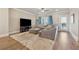 Cozy living room with large rug, comfortable seating, and access to an outdoor space at 1104 Knoxboro Ln, Woodstock, GA 30188