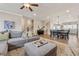Spacious open-concept living area with living room, dining area, and kitchen at 1104 Knoxboro Ln, Woodstock, GA 30188