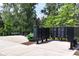Community mailboxes and seating area surrounded by lush trees and landscaping at 1104 Knoxboro Ln, Woodstock, GA 30188