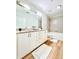Bathroom features granite countertops, double sinks, and tub with tiled enclosure at 400 W Peachtree Nw St # 2704, Atlanta, GA 30308