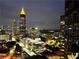 Nighttime cityscape view featuring lit skyscrapers and high-rise buildings from an upper floor at 400 W Peachtree Nw St # 2704, Atlanta, GA 30308