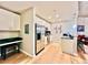 Modern kitchen with white cabinets, stainless steel appliances, and black countertops at 400 W Peachtree Nw St # 2704, Atlanta, GA 30308