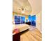 Light-filled main bedroom with hardwood floors, walk-out balcony, and city views at 400 W Peachtree Nw St # 2704, Atlanta, GA 30308