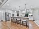 Bright kitchen featuring a large island with seating, stainless steel appliances, and open layout at 4450 Barony Dr, Suwanee, GA 30024